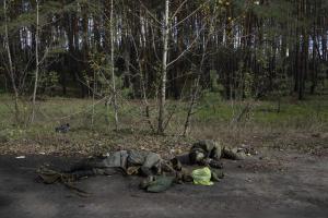 5 of 16
EDS NOTE: GRAPHIC CONTENT - Dead bodies of Russian servicemen lie on the ground in the recently recaptured town of Lyman, Ukraine, Monday, Oct. 3, 2022. (AP Photo/Evgeniy Maloletka)