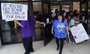 People leave a meeting where the school district’s former police chief was dismissed in August. Photograph: Eric Gay/AP
