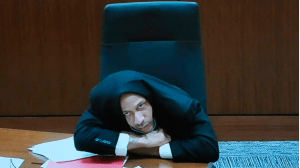 Darrell Brooks looks up during jury selection as he appears via video from an adjacent courtroom due to his incessant interruptions Oct. 3.  (Pool via Mike De Sisti / The Milwaukee Journal Sentinel)