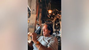 In this photo provided by Ibrahim Almadi, Saad Ibrahim Almadi sits in a restaurant in an unidentified place, in the United States, on August 2021. (Ibrahim Almadi via AP)