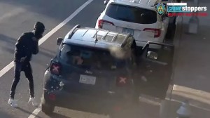 A gunshot is seen striking the rear of a Jeep in New York City's Bronx borough on Oct. 21. (NYPD Crime Stoppers)