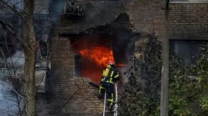 Firefighters work to put out a fire in a residential building hit by a Russian missile strike, amid Russia's attack on Ukraine, in Kyiv, Ukraine November 15, 2022.  (REUTERS/Oleksandr Gusev)