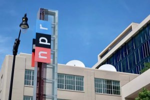 NPR sign at headquarters building entrance in Washington, D.C. (photo: DCStockPhotography / Shutterstock)