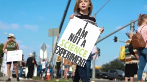 Protesters demonstrate outside the San Diego Unified School District office in San Diego, California, on Sept. 28, 2021. (Sandy Huffaker/Getty Images)