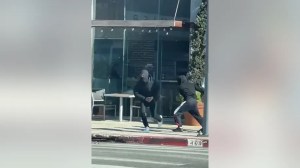 Two alleged assailants running away after robbing a Rolex in Los Angeles, CA. (Credit: LAPD) (Los Angeles Police Department)