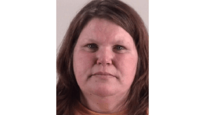 Lorraine Marie Rew, 46, allegedly scammed an older man she met online out of over $1.2 million, of which was spent on Oklahoma casinos, a report says. (Hancock County Police Department)