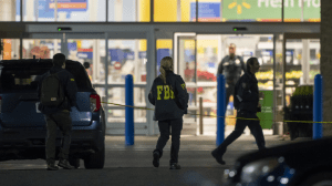Law enforcement, including the FBI, work the scene of a mass shooting at a Walmart on Nov. 23, in Chesapeake, Virginia. (AP/Alex Brandon)