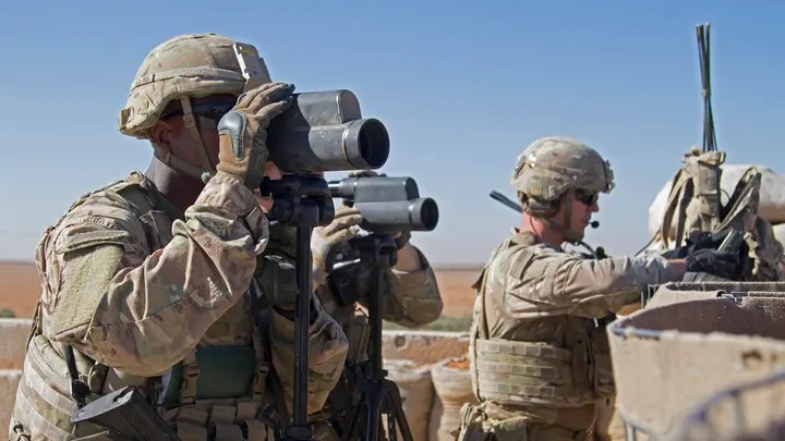 U.S. soldiers surveil the area during a combined joint patrol in Manbij, Syria. (U.S. Army photo by Spc. Zoe Garbarino via AP)