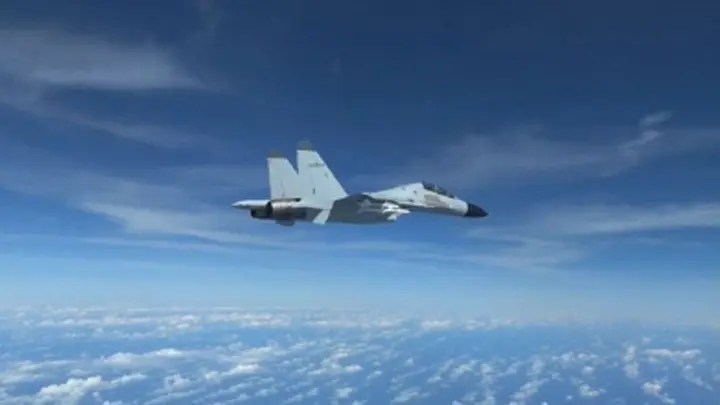 Footage of a Chinese pilot flies a jet just 10-feet away from a U.S. Airforce RC-135 plane on Dec. 21. (Credit: Department of Defense) ((Credit: Department of Defense))