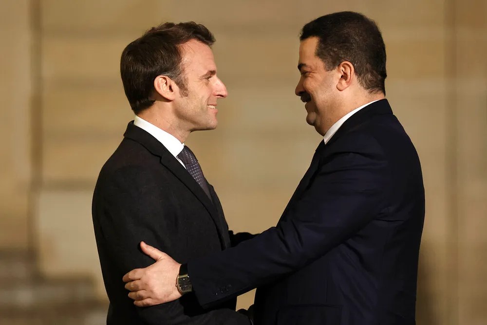 AP Photo/Aurelien MorissardFrench President Emmanuel Macron (L) welcomes Iraqi Prime Minister Mohammed Shia al-Sudan in Paris, France, on January 26, 2023.