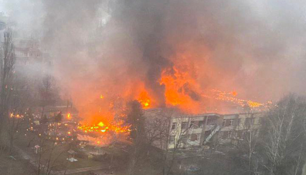 Government handout image from Ukrinform shows buildings burning after a helicopter crash near Kviy on Wednesday.