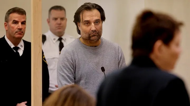 Brian Walshe, center, listens during his arraignment Wednesday, Jan. 18, 2023, at Quincy District Court, in Quincy, Mass., on a charge of murdering his wife Ana Walshe. (Craig F. Walker/The Boston Globe via AP, Pool)