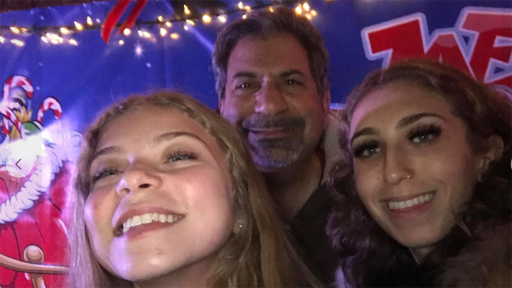 Carlo Secondino shared a photo to Facebook smiling with his two daughters. (Facebook)