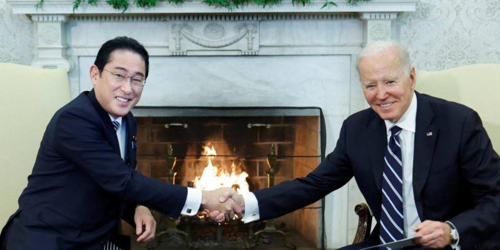 U.S. President Joe Biden shakes hands with Japan's Prime Minister Fumio Kishida during a bilateral meeting at the White House in Washington on Jan. 13.    © Reuters