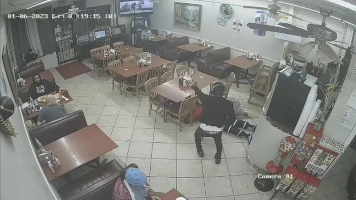 Surveillance video shows 30-year-old Eric Eugene Washington threaten patrons.  (Fox News)