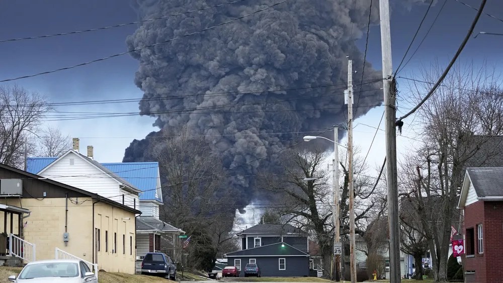 A black plume rises over East Palestine, Ohio, after a controlled release and incineration of chemicals from a derailed Norfolk Southern train on Feb. 6, 2023. (AP Photo/Gene J. Puskar)