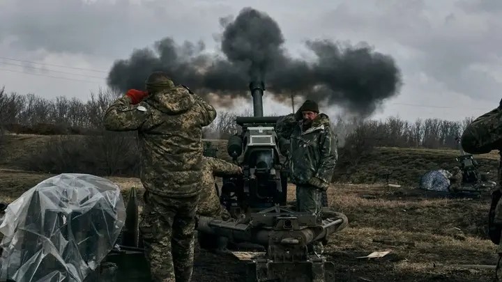 Ukrainian soldiers fire a self-propelled howitzer toward Russian positions near Bakhmut, the site of the heaviest battles in Ukraine's Donetsk region, Tuesday, March 7, 2023.  (AP Photo/Libkos)